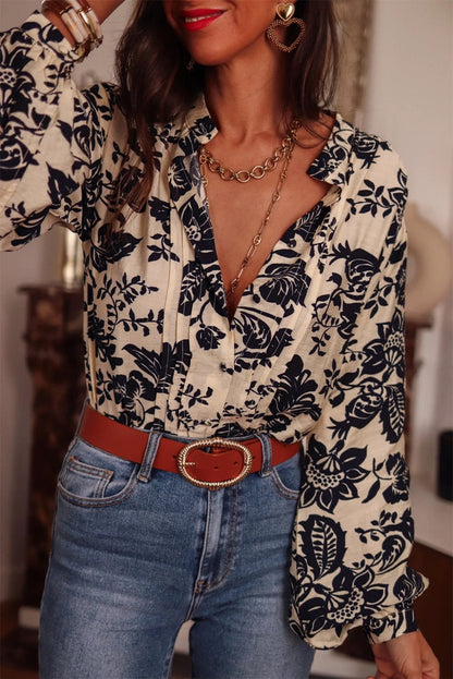 Eleanor® | Black pleated shirt with lantern sleeves and v-neck boho style floral print